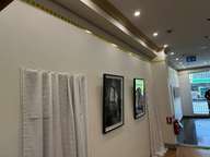 a wall with a picture hanging on it