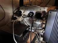 a clock with a bunch of wires on it