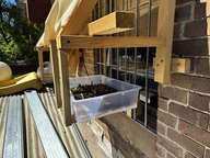 a window with a window box full of plants