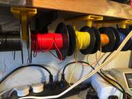 a bunch of wires and wires hanging on a wall